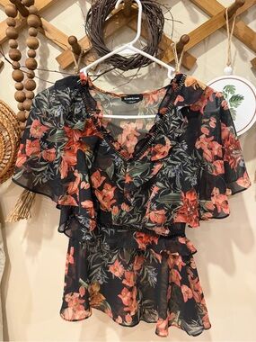 bebe Black Floral Ruffle V-Neck Blouse with Red-Orange Blooms